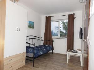 Postel nebo postele na pokoji v ubytování Apartmani Maria - Studio 3