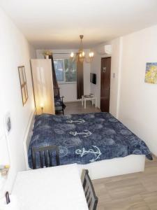 Postel nebo postele na pokoji v ubytování Apartmani Maria - Studio 3