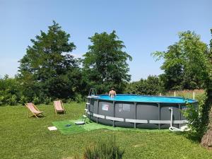 a man standing on top of a inflatablelatable at Kuća za odmor Rina in Pakrac