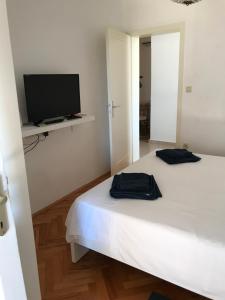 Postel nebo postele na pokoji v ubytování Studio Apartman LENESTA