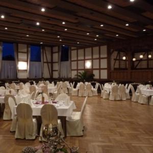 a banquet hall with white tables and white chairs at Braunes Ross in Weidhausen bei Coburg