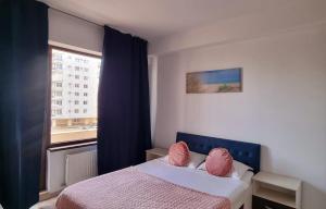 Giường trong phòng chung tại Pescobar Mamaia