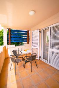 a room with a table and chairs and a window at Villa SHU in Krimovice