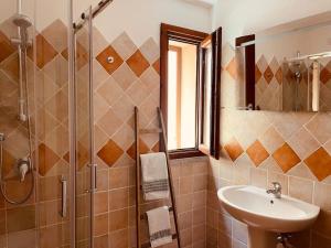 a bathroom with a sink and a shower at Loleni House sub 25 Welcome in Costa Paradiso +31 photos