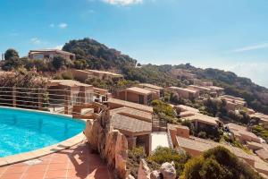a view of a resort with a swimming pool at Loleni House sub 25 Welcome in Costa Paradiso