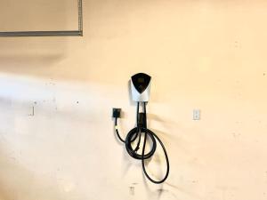 a black cord plugged into a socket on a wall at 5 BR/5 BA Getaway with a View in Thousand Oaks