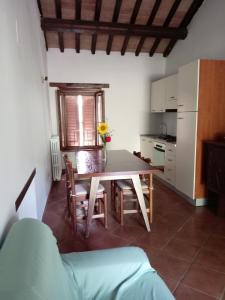 a kitchen and dining room with a table and chairs at La casa dei breton in Magione +53 photos