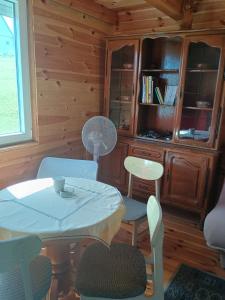a dining room with a table and chairs at Under Milky Way in Podgora