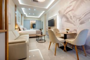a living room with a couch and a bed at Apartmani Laguna in Neum