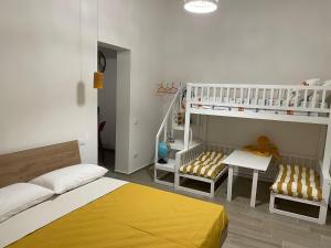a room with two beds and a bunk bed at Casa Vacanza Pitagora in Montalbano Ionico
