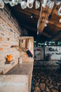 a room with a brick wall and a bench at Villa SHU in Krimovice +37 photos
