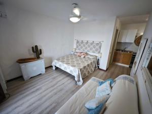 a bedroom with a bed and a couch in it at Vista Smeralda in Porto Rotondo