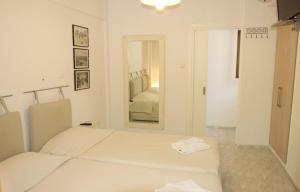Posteľ alebo postele v izbe v ubytovaní Mirto Apartments