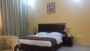 Postel nebo postele na pokoji v ubytování Aryana Hotel