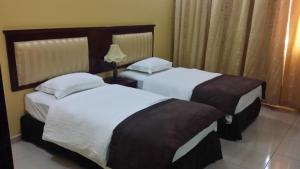Postel nebo postele na pokoji v ubytování Aryana Hotel