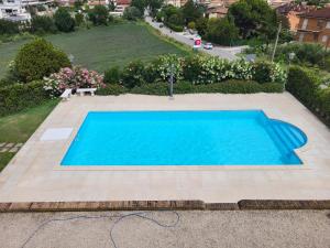 a swimming pool in the middle of a yard at Villa Livia in Fermo +13 photos
