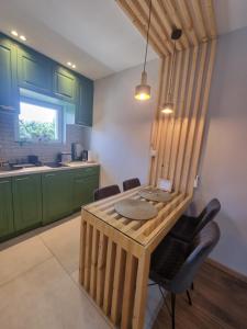 Kuchyň nebo kuchyňský kout v ubytování Luxor Apartmani 2