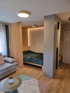 Postel nebo postele na pokoji v ubytování Luxor Apartmani 2