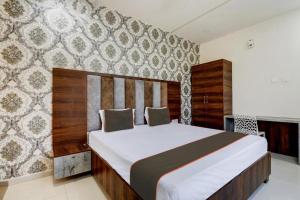 a bedroom with a large bed in a room at Chandana green view resort Hampi in Gangāwati