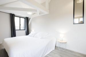 a white bedroom with a white bed and a window at Le Trèfle à Quatre Feuilles in Siorac-en-Périgord +109 photos