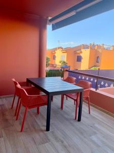 a blue table and chairs on a balcony at Marevento Meloneras in Meloneras