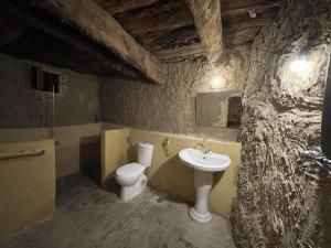 a bathroom with a sink and a toilet at Lotus House in siwa oasis