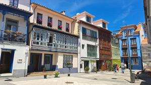 a group of buildings on a city street at LUMARE LUANCO - A 5 min de la playa a pie - Parking incluido in Luanco