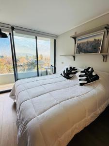 Postel nebo postele na pokoji v ubytování Moderno departamento vanguardista en el corazón de Las Condes
