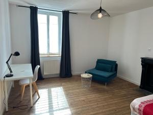 Et opholdsområde på Kery House Calme et proche du Centre