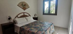 a bedroom with a bed and a window at Villette di Torre Inserraglio in Nardò +288 photos