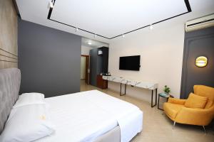 TV a/nebo společenská místnost v ubytování Hotel Erjuma