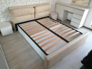 a bed in a room with a couch and a table at Porto DelMar in Constanţa