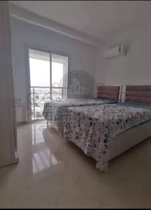 Una cama o camas en una habitación de Appartement dans une belle résidence à Bizerte superbe vue