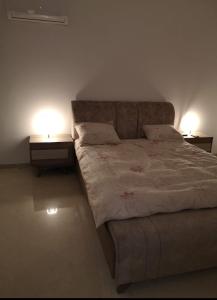 Una cama o camas en una habitación de Appartement dans une belle résidence à Bizerte superbe vue