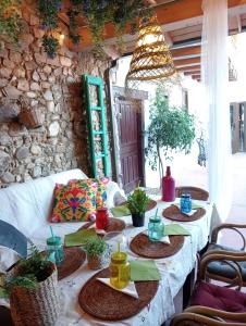 a table with plates of food on top at Casa ENTREPIEDRAS in Villalís