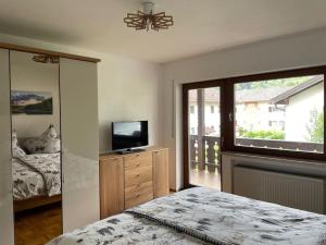 Postel nebo postele na pokoji v ubytování Ferienhaus Partenkirchen