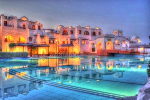 a large swimming pool in a hotel room at Arabella Azur Resort in Hurghada
