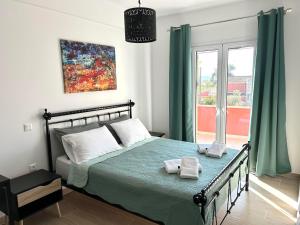A bed or beds in a room at Lime House Corfu