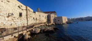 a group of buildings next to a body of water at Garibaldi 5 in Giovinazzo