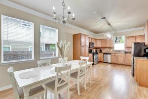 a kitchen with a white dining room table and chairs at Spacious Home-Queen Suite-Game room-Movie room in Austin