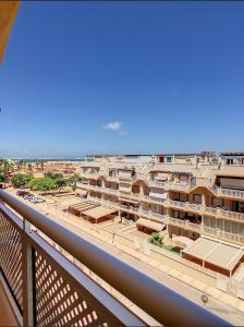 a view of a city from a balcony at Ático Calblanque in Mar de Cristal