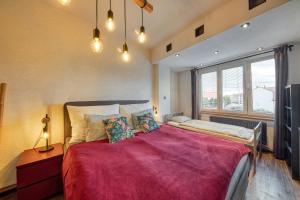 Posteľ alebo postele v izbe v ubytovaní Mahalo Apartment