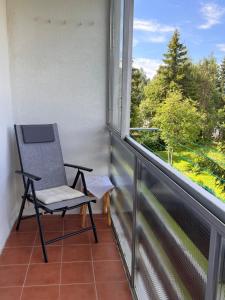 Balkón nebo terasa v ubytování Cozy Apartment by the Forest