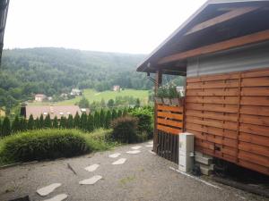 a wooden building with a view of a mountain at Śniegocinka 2 in Brenna