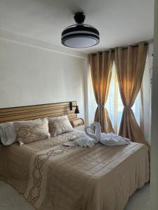 Ένα ή περισσότερα κρεβάτια σε δωμάτιο στο SWEET HOME ALEGRIA-MASCOTAs +21 φωτογραφίες