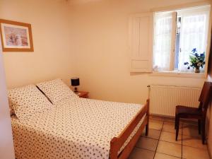 Postel nebo postele na pokoji v ubytování Domaine de Laroque Lou Maïsouet