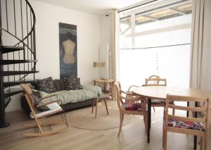 a living room with a couch and a table at Ti Melen in Morlaix