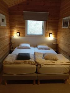 Postel nebo postele na pokoji v ubytování "Au Cha les Vaux" Chalet 49