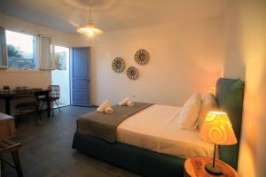 Кровать или кровати в номере Blue Paradise Agios Sostis