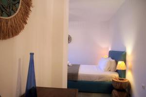 Кровать или кровати в номере Blue Paradise Agios Sostis